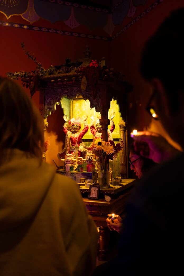 Sanctuary-Retreats-deities-of-Sri-Sri-Gaura-Nitai-and-Jaggannath-Baladev-Subhadra-receiving-Kartika-offerings-during-Puspanjali.-image-by-Natalie-Occhino